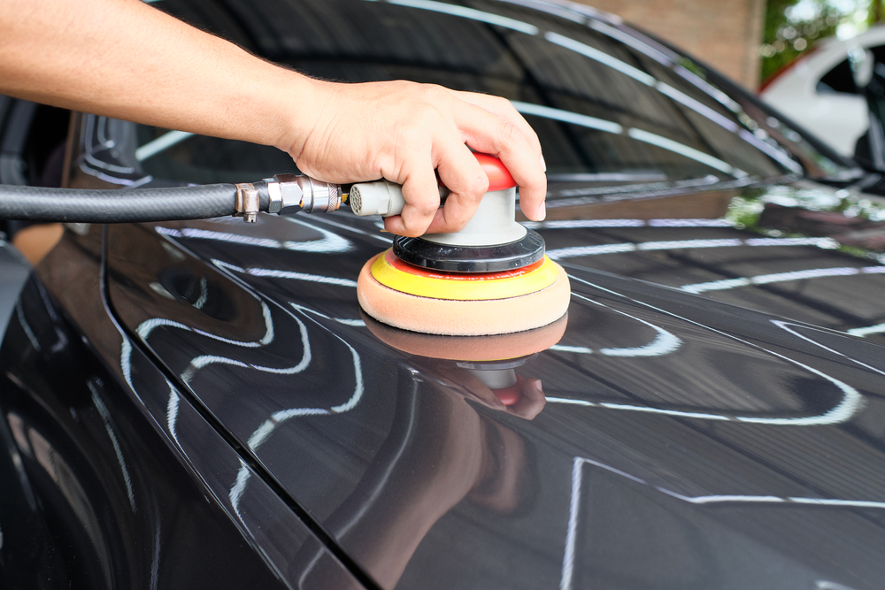 Professional,auto,detailer,hand,holding,air,random,orbital,sander,or